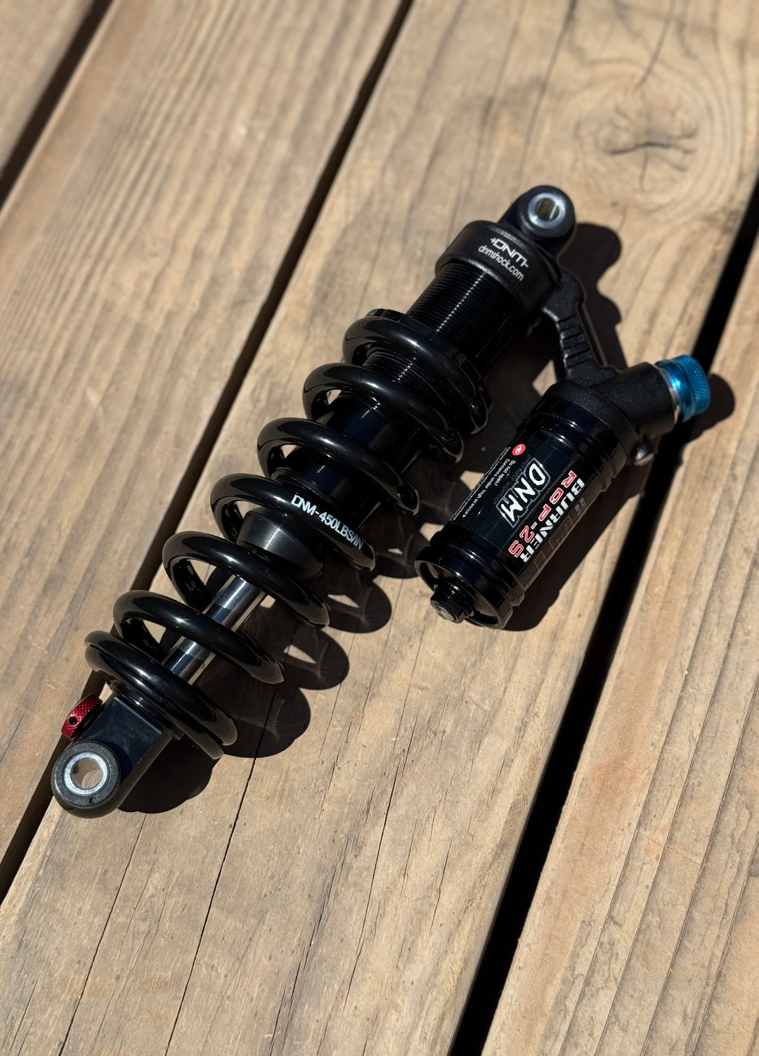 Electro & Co Razor SX500 DNM RCP-2S rear shock with 450 lb spring, adjustable damping and rebound for suspension upgrade.
