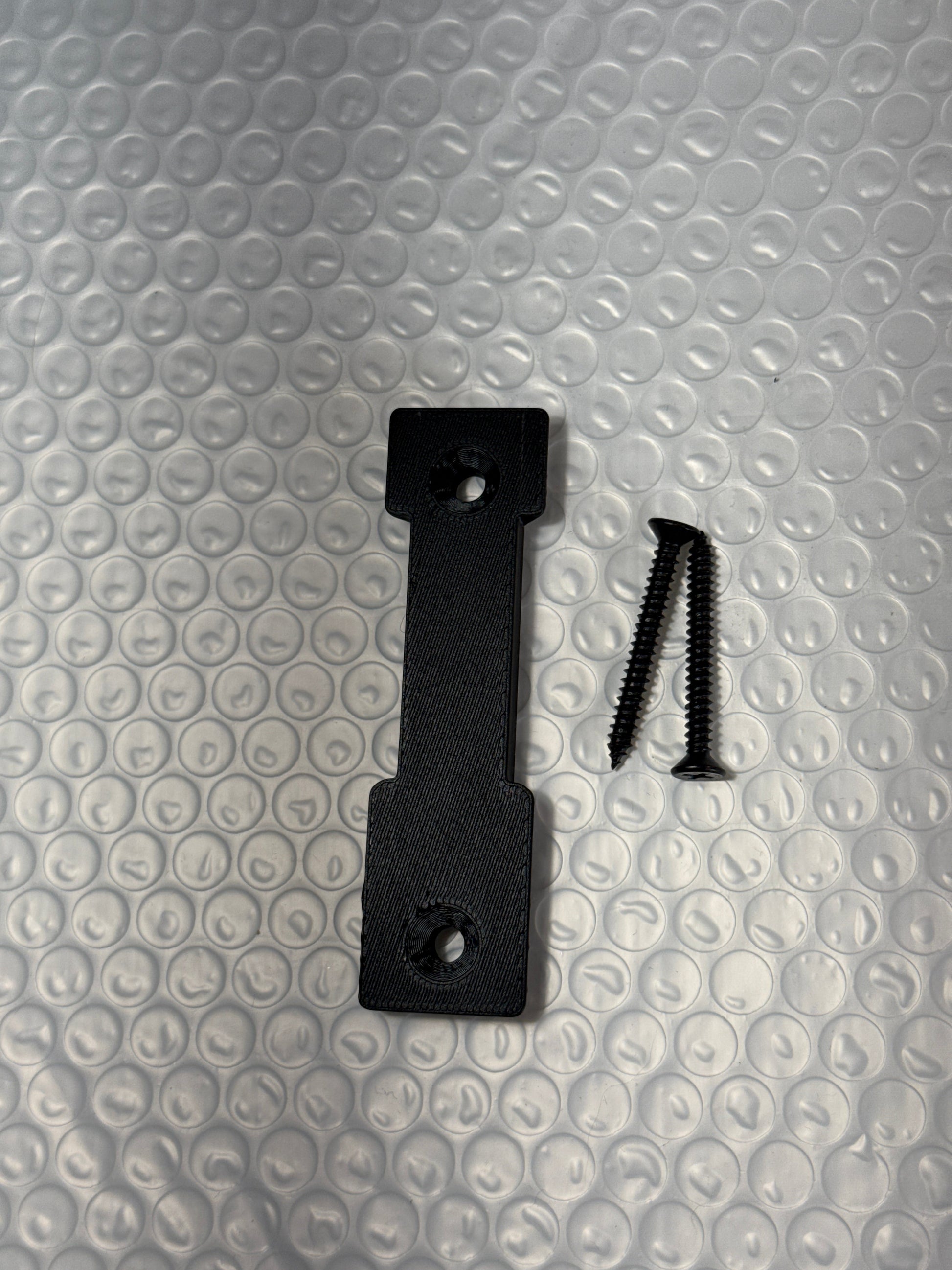 McCoy Industries extra wall mount plate for helmet mount system, accessory used for securing helmet accessories on walls.