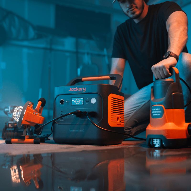 Refurbished Jackery Explorer 2000V2 portable power station with multiple outlets and digital display for portable energy storage.