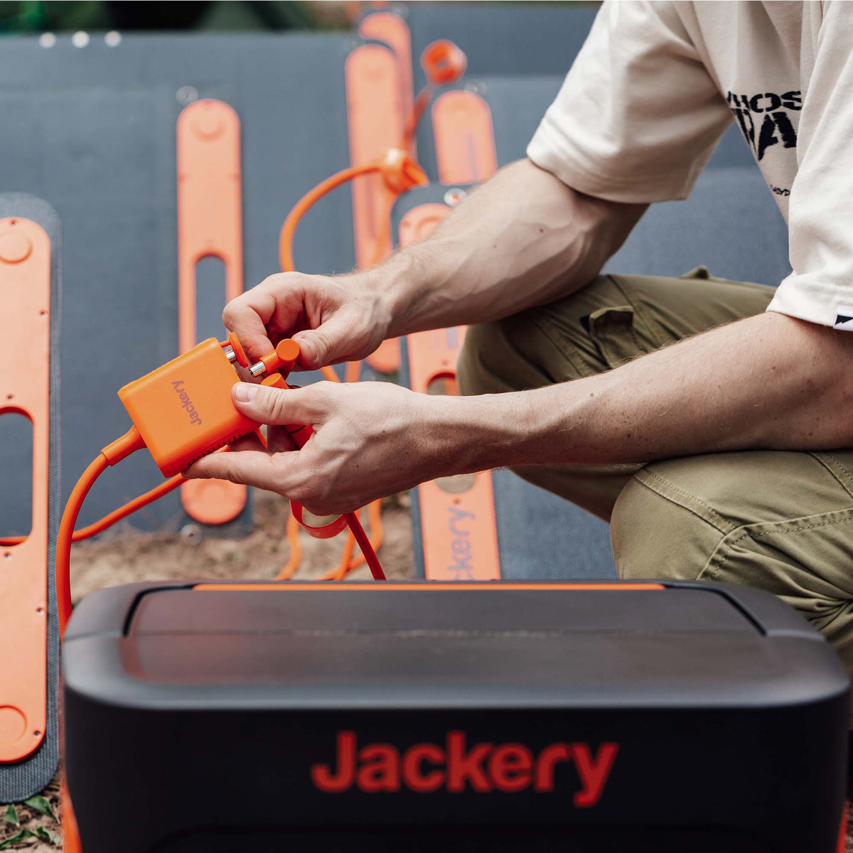 Jackery Solar Panel Connector for handbags, showing a compact black connector with cable attached for solar power integration.
