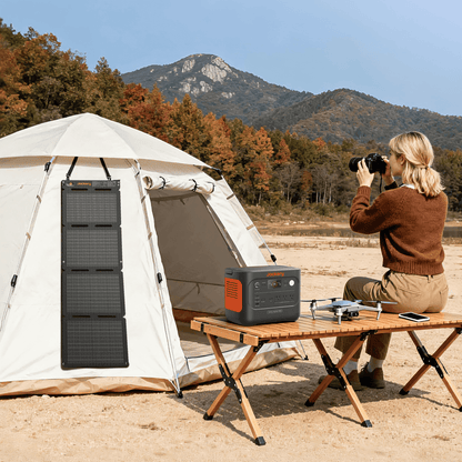 Jackery SolarSaga 40 Air portable solar panel outdoors, showing its compact design and solar cells for renewable energy.