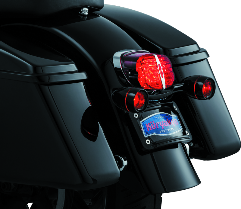Kuryakyn Bullet Light Rear Turn Signal Bar for Harley Davidson in gloss black, featuring sleek design and mounting hardware