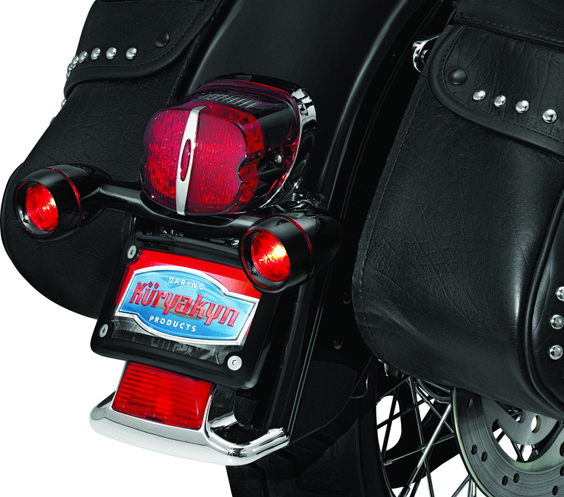 Kuryakyn Bullet Light Rear Turn Signal Bar for Harley Davidson in gloss black, designed for motorcycle rear signal lighting.