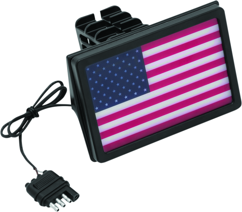 Kuryakyn Freedom Flag LED Hitch Cover in black attached to a vehicle's receiver hitch, fits 1-1/4 inch and 2-inch hitch receivers.