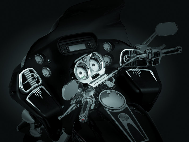 Chrome Kuryakyn glove box accents for Harley Davidson Road Glide with ergonomic finger catch and sleek trim detail.