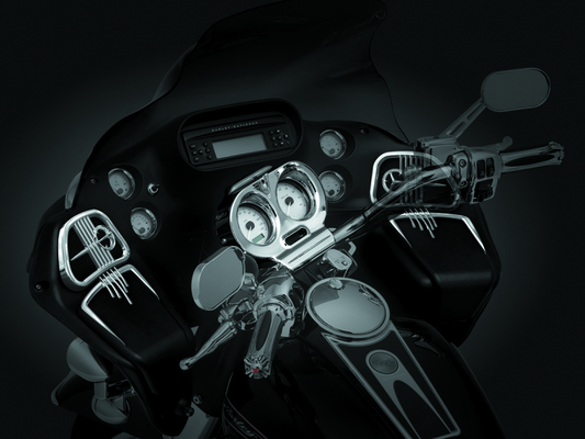 Chrome Kuryakyn glove box accents for Harley Davidson Road Glide with ergonomic finger catch and sleek trim detail.