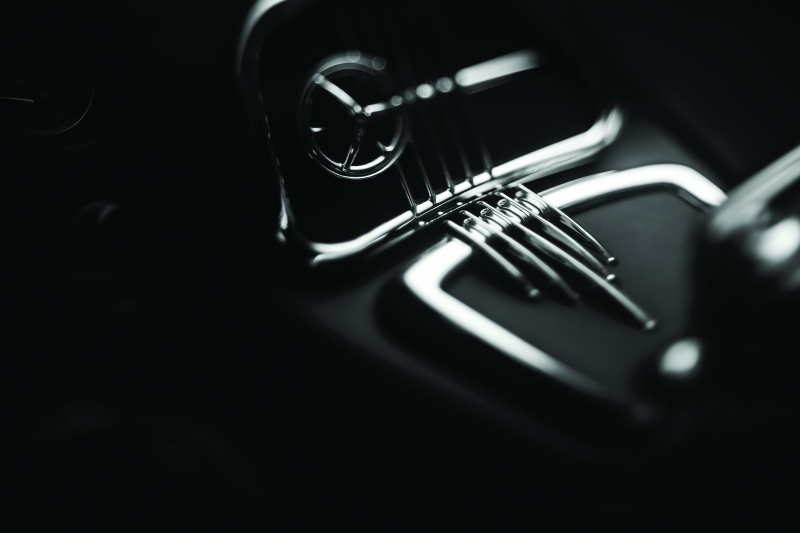 Chrome glove box accents with ergonomic finger catch for Harley Davidson Road Glide by Kuryakyn, enhancing style and convenience.