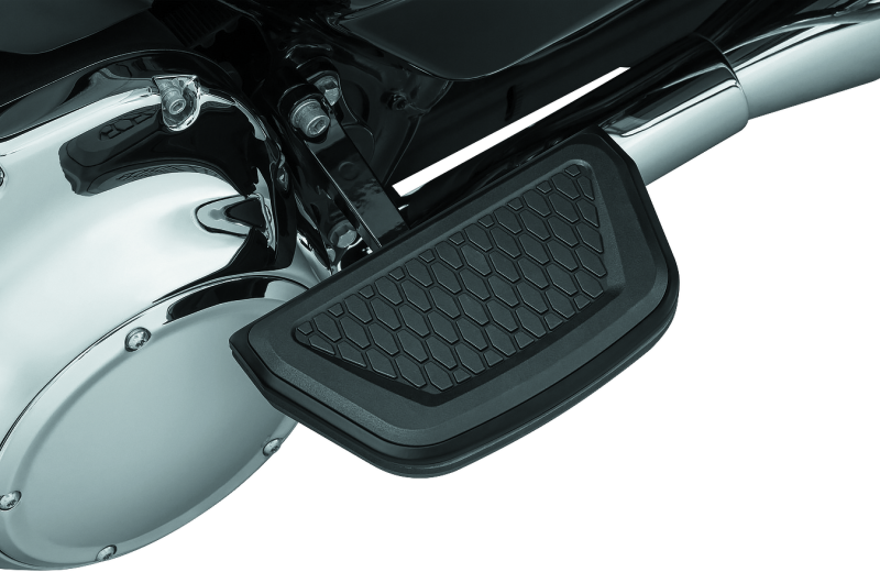 Black Kuryakyn Hex Passenger Board Inserts for Harley Davidson Touring Models, part #5903, shown on motorcycle passenger footboards.