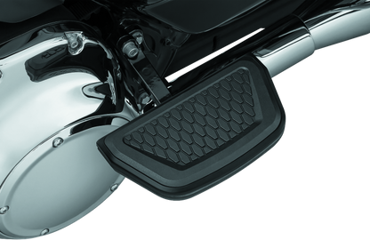 Black Kuryakyn Hex Passenger Board Inserts for Harley Davidson Touring Models, part #5903, shown on motorcycle passenger footboards.