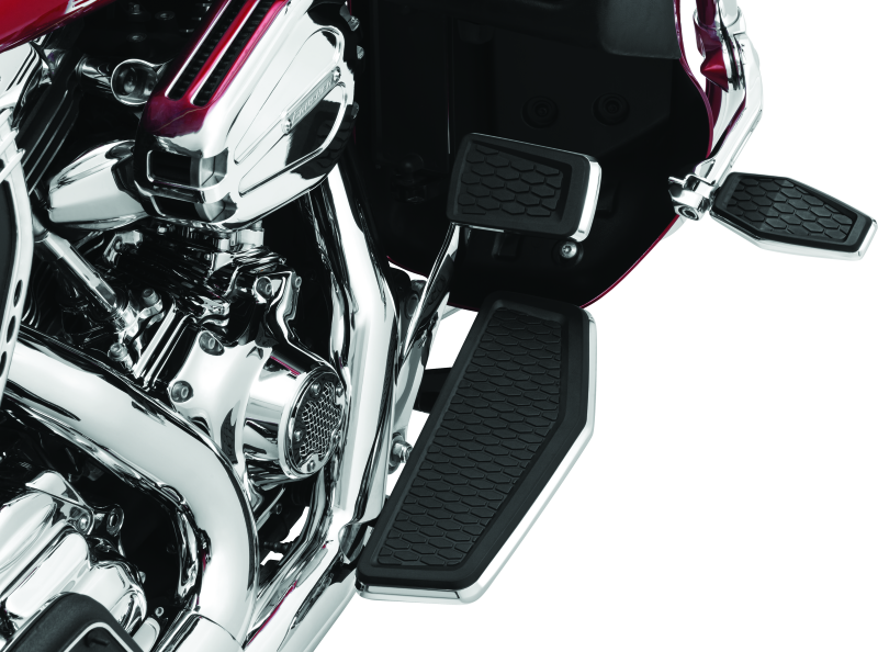 Chrome Kuryakyn Hex Pegs with Adapters for powersports vehicles, showing polished metal pegs attached to motorcycle engine mounts.