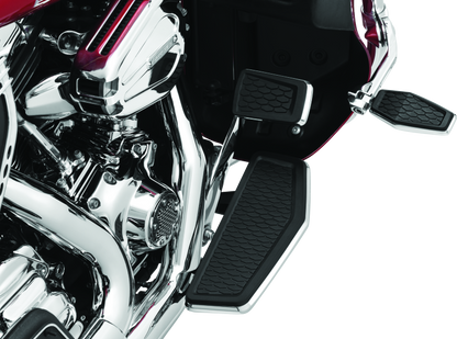 Chrome Kuryakyn Hex Pegs with Adapters for powersports vehicles, showing polished metal pegs attached to motorcycle engine mounts.