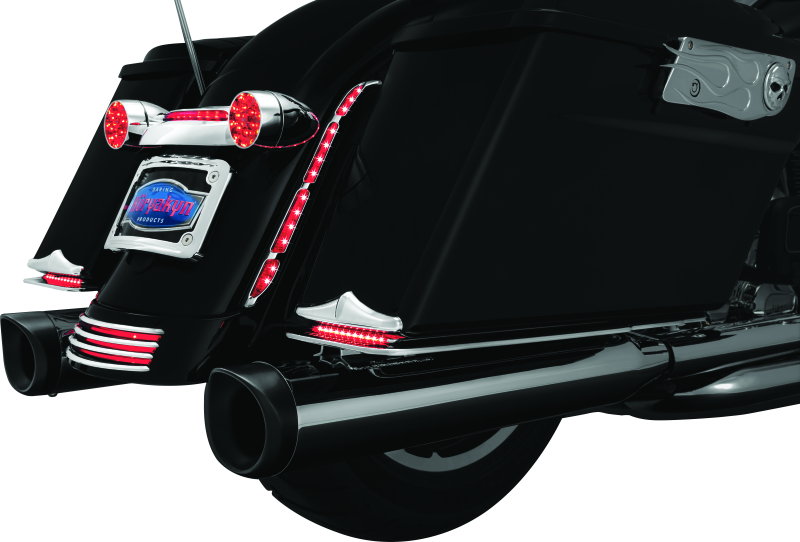 Kuryakyn LED turn signal bar filler panel installed on Harley Davidson FLHX and FLTRX models, showcasing sleek motorcycle accessories.