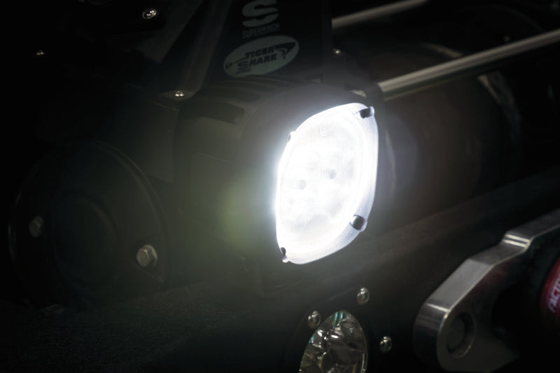Kuryakyn Lodestar 1850L high-output spot beam driving lights for powersports vehicles, shown mounted on a vehicle.