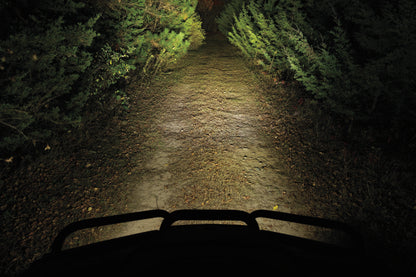 Kuryakyn Lodestar 1850L Spot Beam high-output driving lights for powersports vehicles, mounted on a motorcycle or ATV.