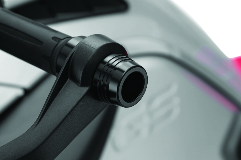 Kuryakyn Lodestar handlebar sliders in black for BMW R1200GS motorcycle, mounted on the handlebars for protection and style.