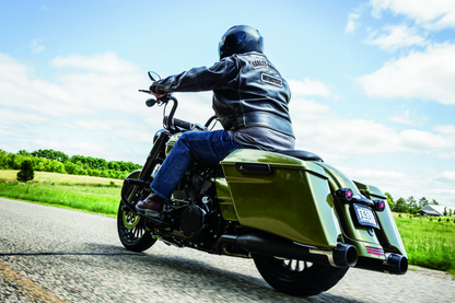 Kuryakyn Mesh Derby Cover in black for Harley-Davidson touring models, part #6527, shown on a motorcycle engine.