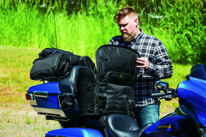 Kuryakyn Momentum Wanderer Seat Bag with 60L storage, padded backrest, and organized compartments for touring passenger seat.