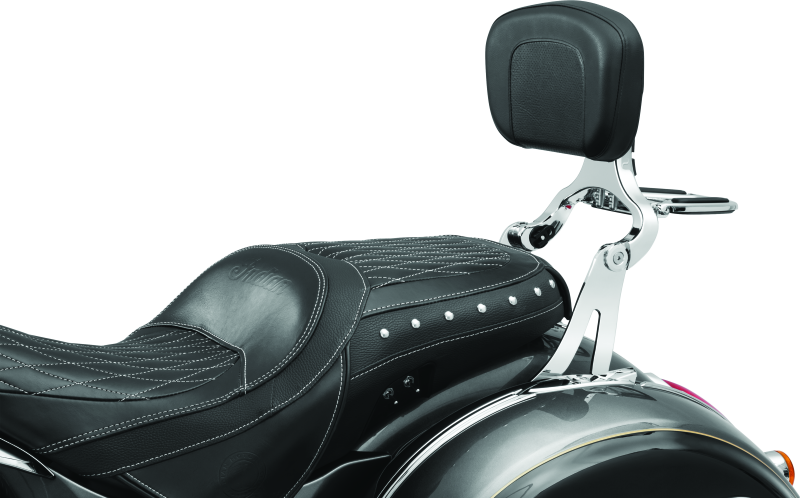 Kuryakyn Multi-Purpose Backrest with Luggage Rack mounted on motorcycle seat, featuring padded backrest and durable luggage rack.