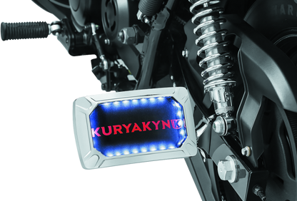 Kuryakyn Nova curved horizontal side license plate holder with integrated LED lighting for motorcycles.