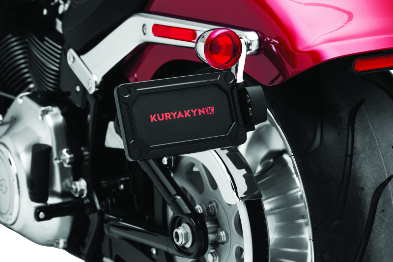Kuryakyn Nova side mount license plate frame for Harley Davidson in gloss black, made of durable metal with mounting hardware