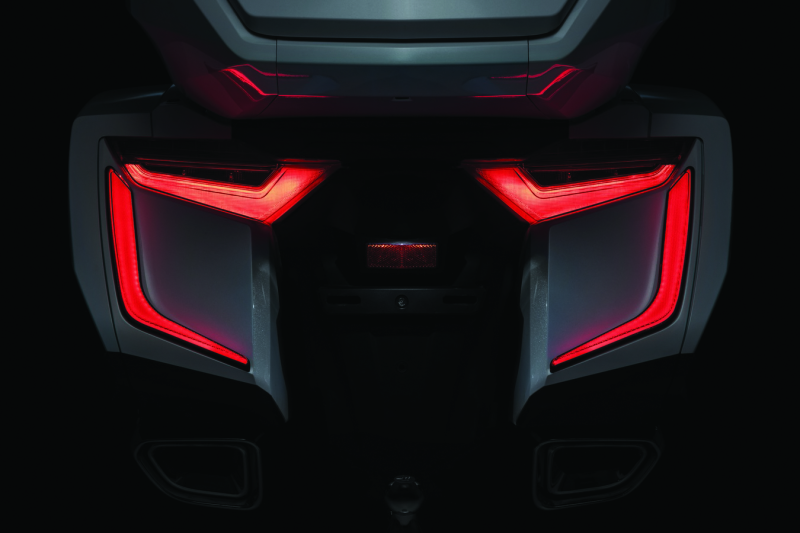 Kuryakyn Omni LED rear bag accents on a Honda GL1800 Gold Wing motorcycle, showcasing sleek LED lighting for luggage area.