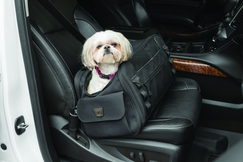Kuryakyn Pet Palace Flyweight Carrier for travel and powersports, showing lightweight pet carrier with mesh sides and secure zippers.