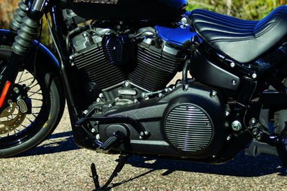 Black Kuryakyn Precision Coil Cover for Harley-Davidson Softail 2018-2025, showcasing a sleek, durable engine component.