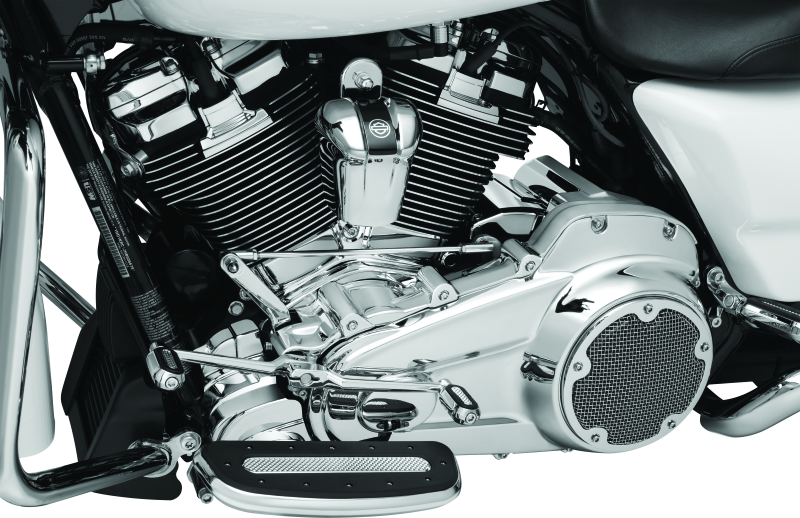 Chrome Kuryakyn Precision Lower Frame Cover for Harley Davidson Touring models, shiny and detailed on the motorcycle frame.