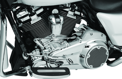 Chrome Kuryakyn Precision Lower Frame Cover for Harley Davidson Touring models, shiny and detailed on the motorcycle frame.