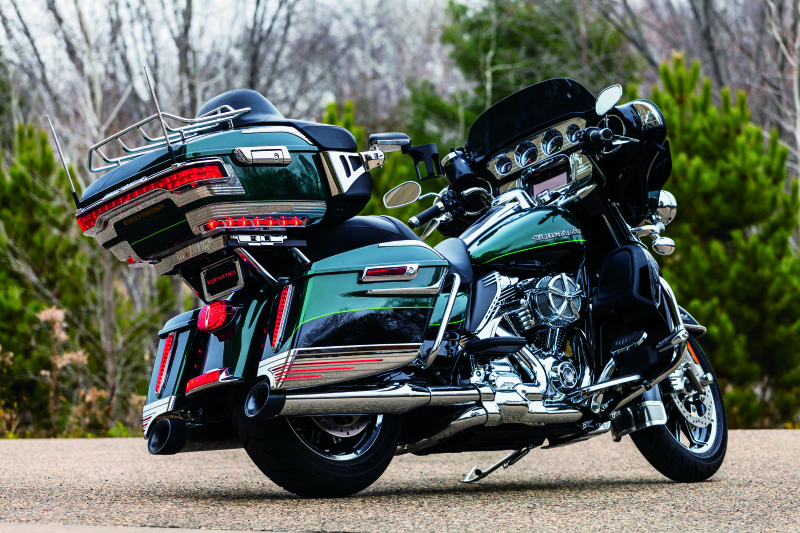 Kuryakyn Tour-Pak Relocator for 14-Up Touring Models in black, showing the adjustable mounting bracket for enhanced luggage fit.