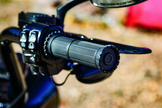 Kuryakyn Riot Grips Throttle-By-Wire with Satin Black Finish for 1-Inch Bars on a motorcycle handlebar