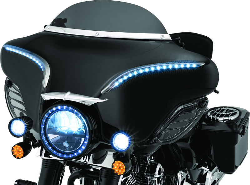 Kuryakyn Smooth Windshield Trim for Harley Davidson Touring models 96-13, chrome finish, installed on motorcycle windshield.