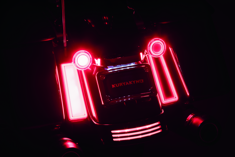 Kuryakyn Tracer Filler Panel Lights with red lens for saddlebags, custom LED accent lighting on motorcycle.