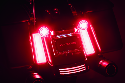 Kuryakyn Tracer Filler Panel Lights with red lens, custom LED accent for motorcycle saddlebags, enhancing style and visibility.
