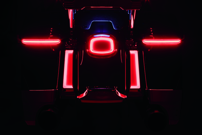 Kuryakyn Tracer LED taillight with red lens and license plate light for Harley Davidson motorcycle.