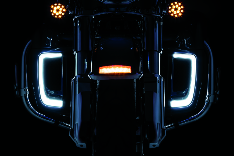 Chrome Kuryakyn Tracer Lower Fairing Grill for Harley Davidson Touring models, showcasing a sleek, detailed motorcycle accessory.