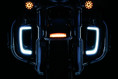Chrome Kuryakyn Tracer Lower Fairing Grill for Harley Davidson Touring models, showcasing a sleek, detailed motorcycle accessory.