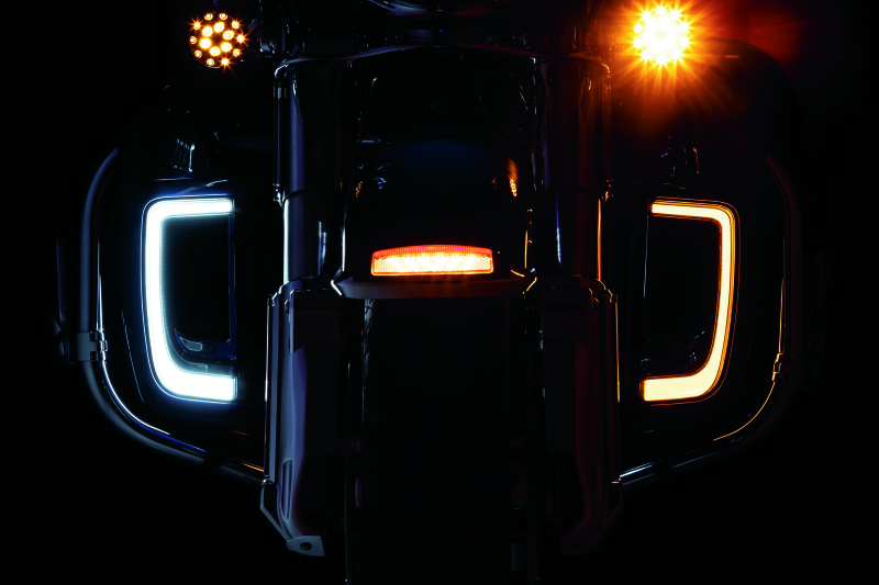 Chrome Kuryakyn Tracer Lower Fairing Grill for Harley Davidson Touring Models, close-up of the shiny, decorative motorcycle fairing accessory.