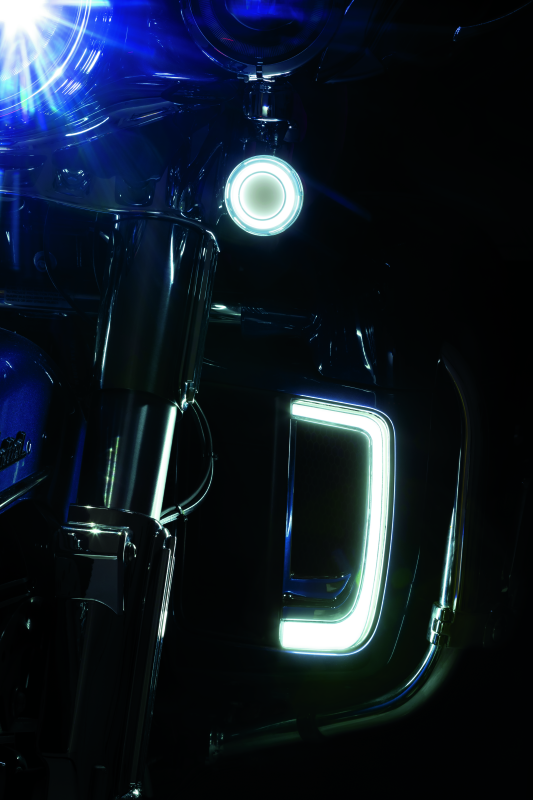 Chrome Kuryakyn Tracer Lower Fairing Grill installed on a Harley Davidson Touring model motorcycle.