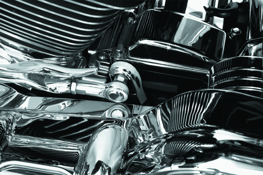 Chrome transmission shift arm cover by Kuryakyn for Harley Davidson Touring models, showing detailed chrome finish on the shift arm.