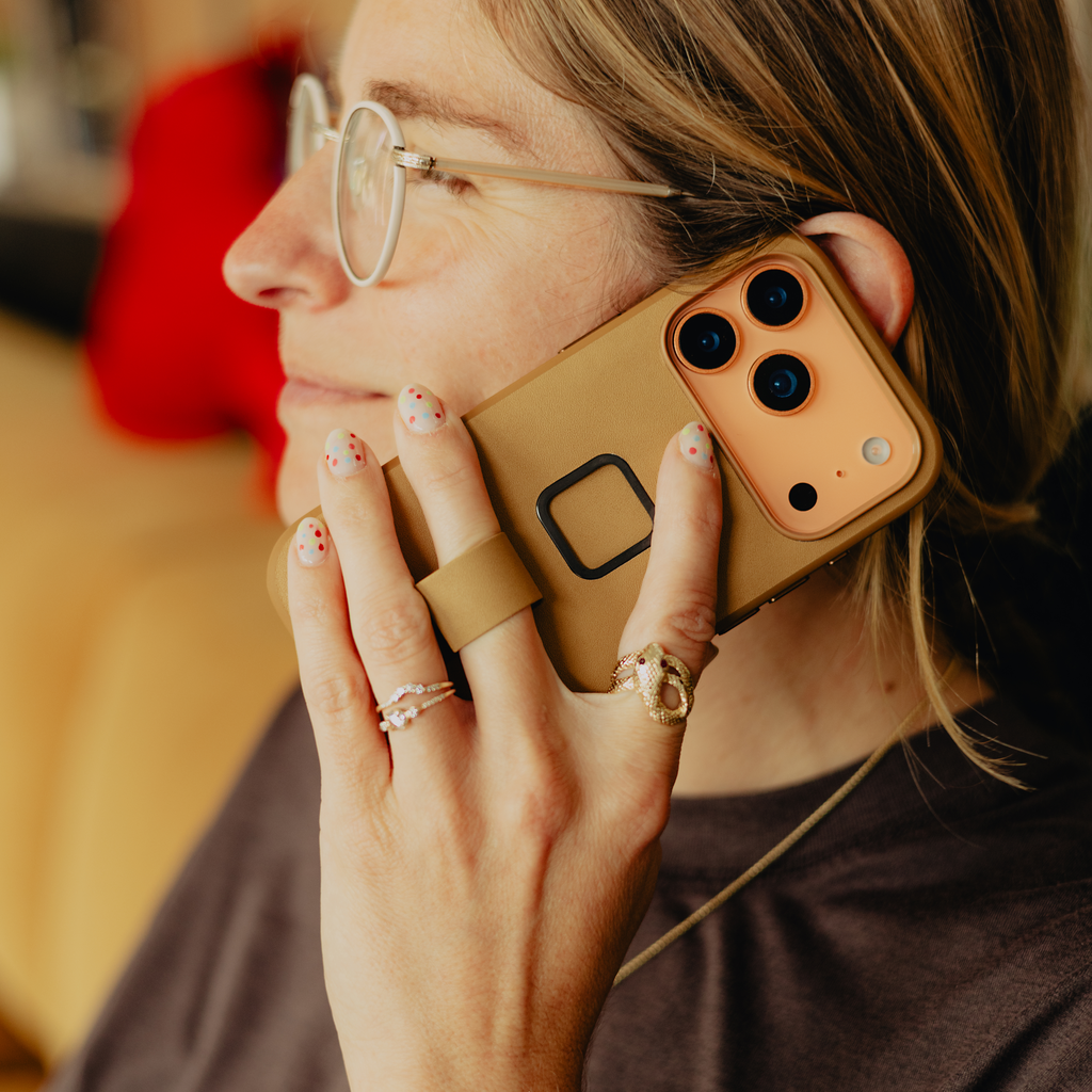 Peak Design Everyday Loop Case for iPhone 17 Pro in tan, showing protective mobile phone cover with loop strap design.