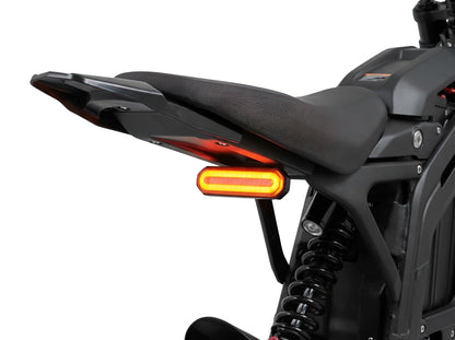 Project9 Talaria MX4/MX5 V2 CYBER tail light mounted on white background, showcasing its sleek, functional design for electric motocross bikes.
