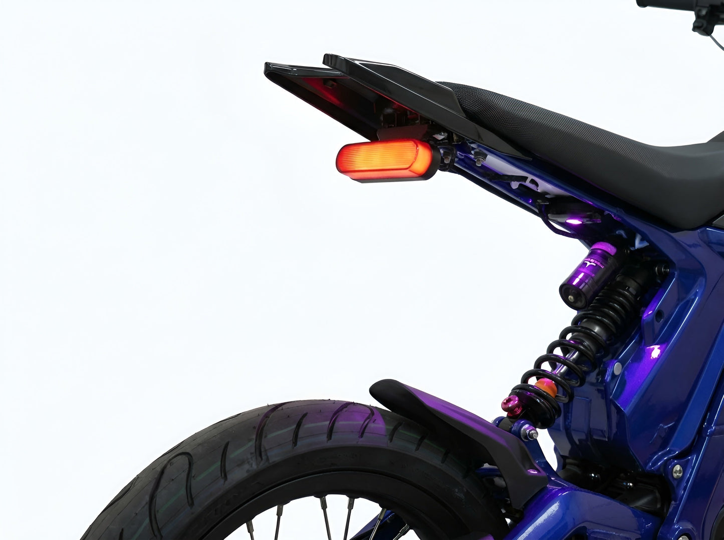 Open view of Project 9 Functional Cyber Brake Light installed on Talaria XXX electric dirt bike against a white background.