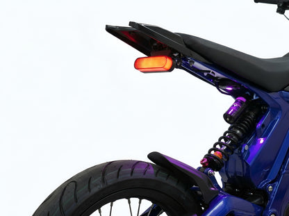 Open view of Project 9 Functional Cyber Brake Light installed on Talaria XXX electric dirt bike against a white background.