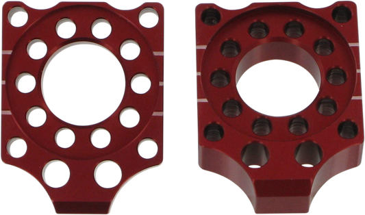 Red PRO CIRCUIT axle blocks for Honda CRF 150R motorcycle, designed for secure wheel alignment and stability.