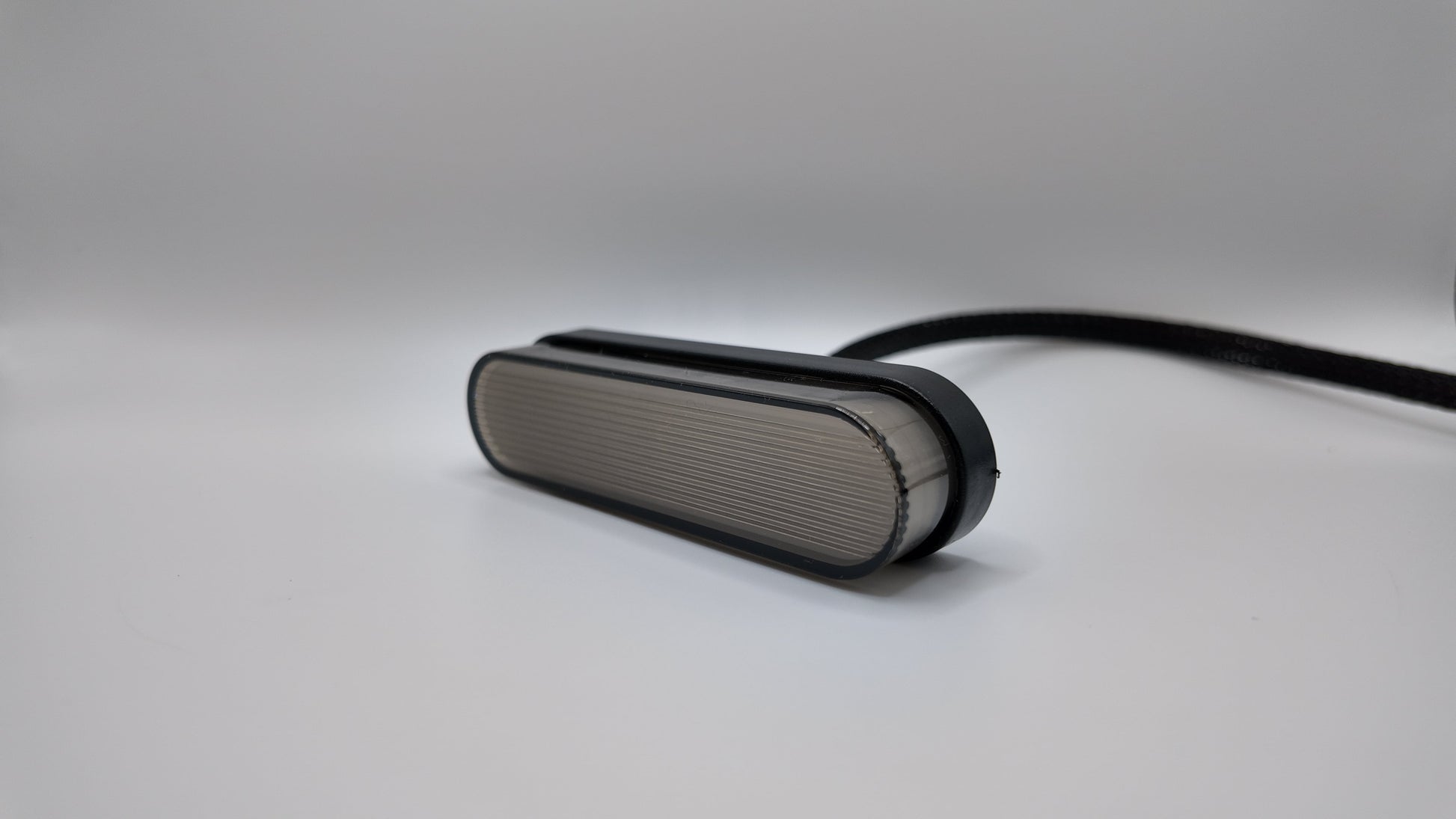 E-Ride 3.0 Cyber Brake Light by Project9 with 2-pin connector, showing the sleek, functional bike brake light in black.