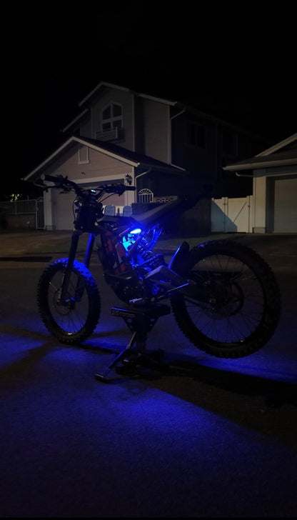 Purple rear underglow kit for Surron Light Bee by Project9, installed on Surron electric bike with vibrant LED underglow lighting.