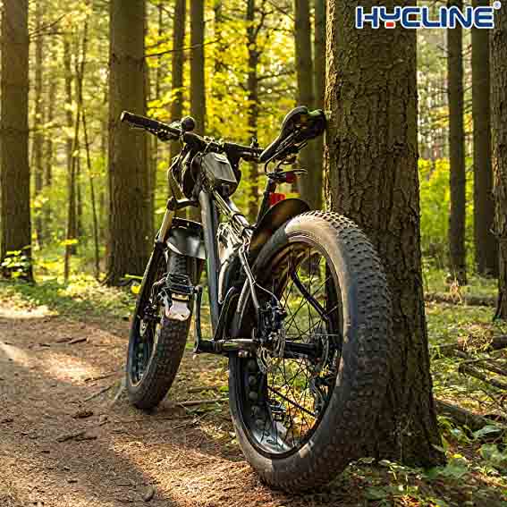 Hycline fat bike tire mounted on E-bike, showcasing durable tread design for off-road riding and stability on rugged terrain.