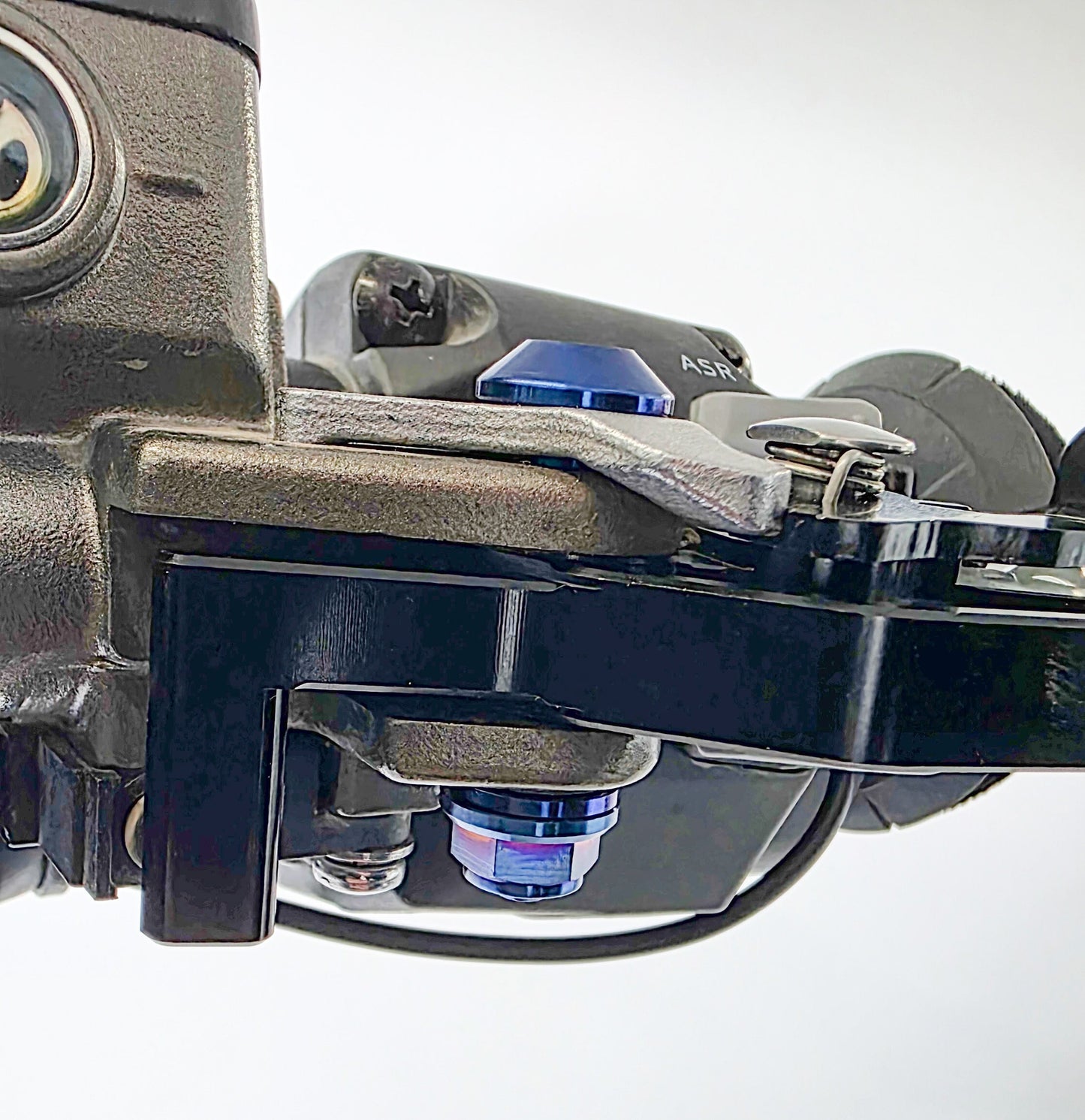Warp 9 Racing shorty titanium lever pivot bolts in burnt blue for Sur-Ron Ultra Bee, made from Grade 5 titanium.