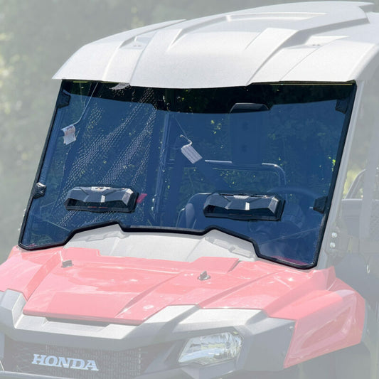 SEIZMIK tool-less UTV windshield made of hard-coated polycarbonate, shown installed on a UTV for protection against elements.